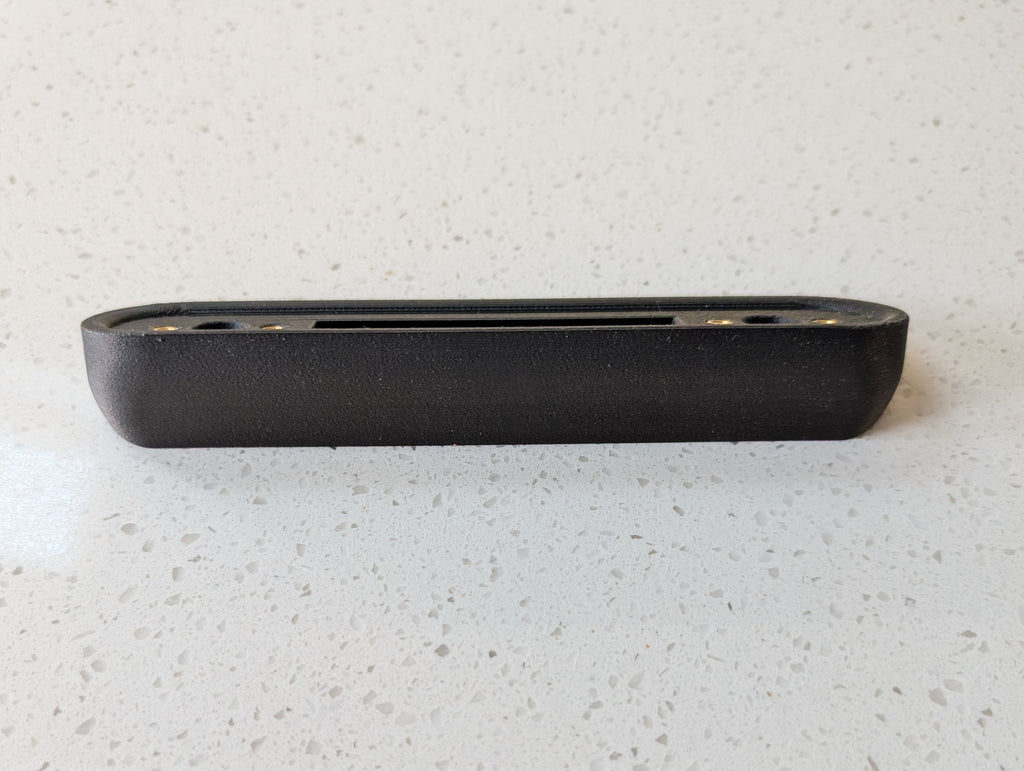 Google Nest Doorbell (Battery) Reversible Angle Mount, in grey. Unmounted on worksurface.