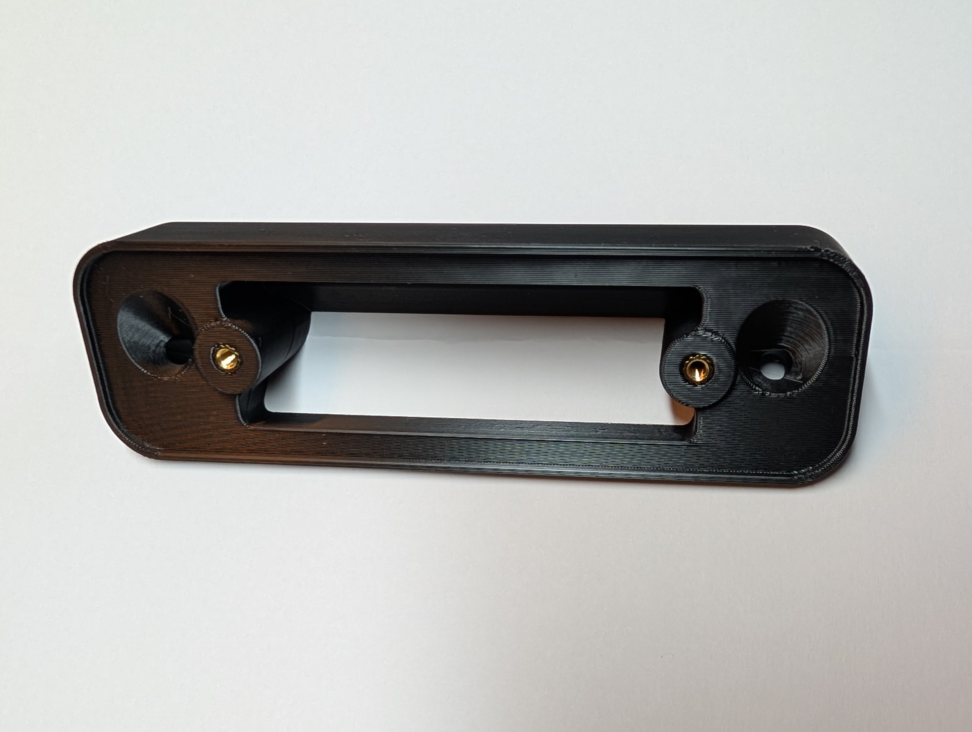 Blink Video Doorbell (Version 1) Reversible Angle Mount, in black. Unmounted on work surface