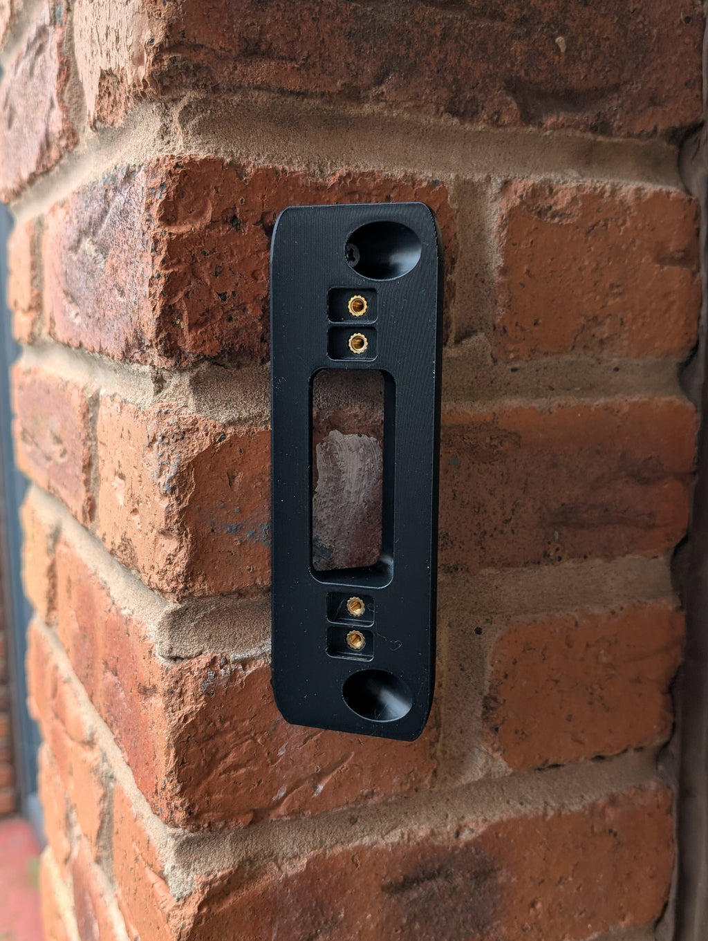 Eufy Video Doorbell Dual S330 Reversible Angle Mount, in black. Mounted on wall.
