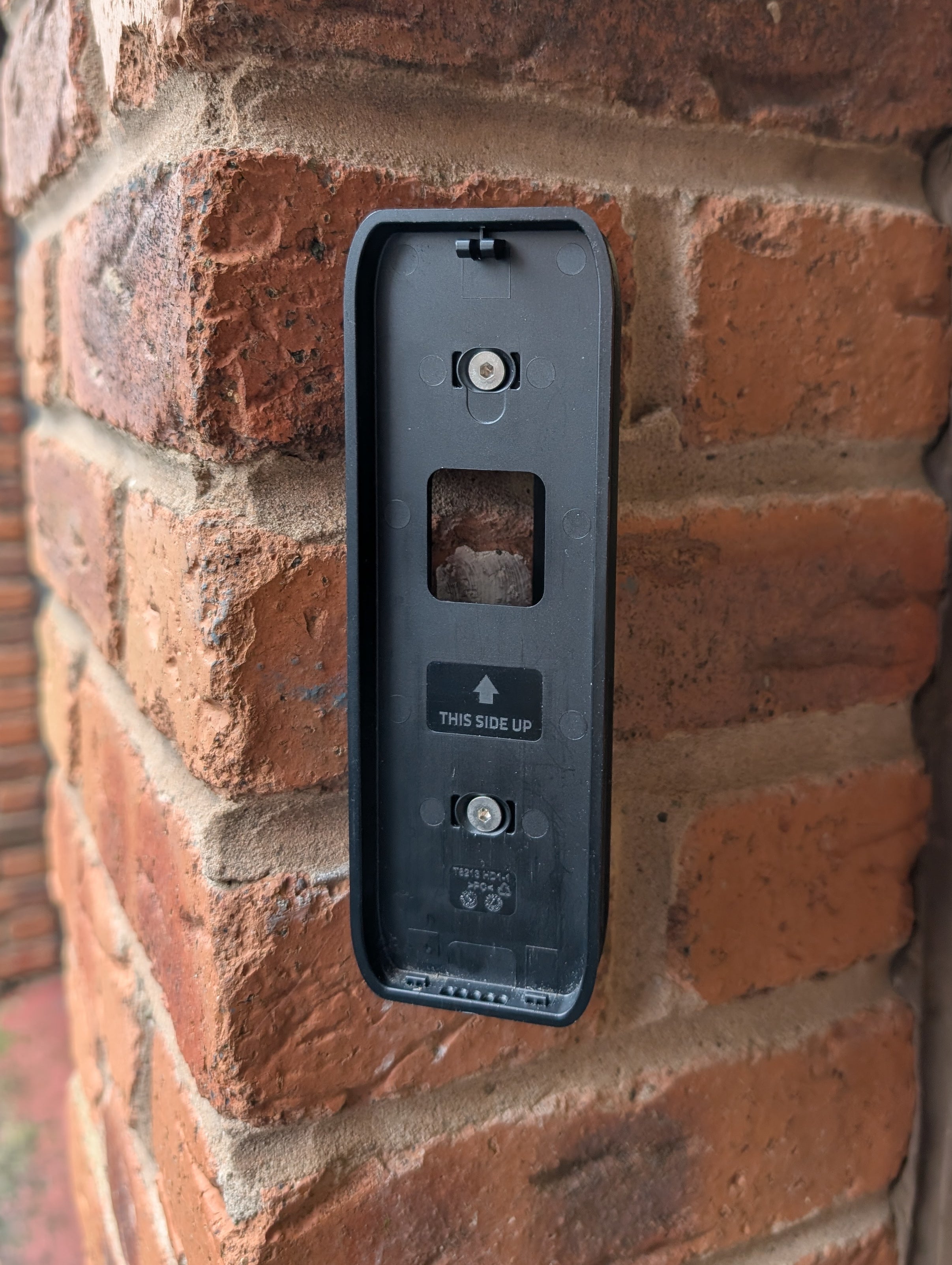 Eufy Video Doorbell Dual S330 Reversible Angle Mount, in black. Mounted on wall.