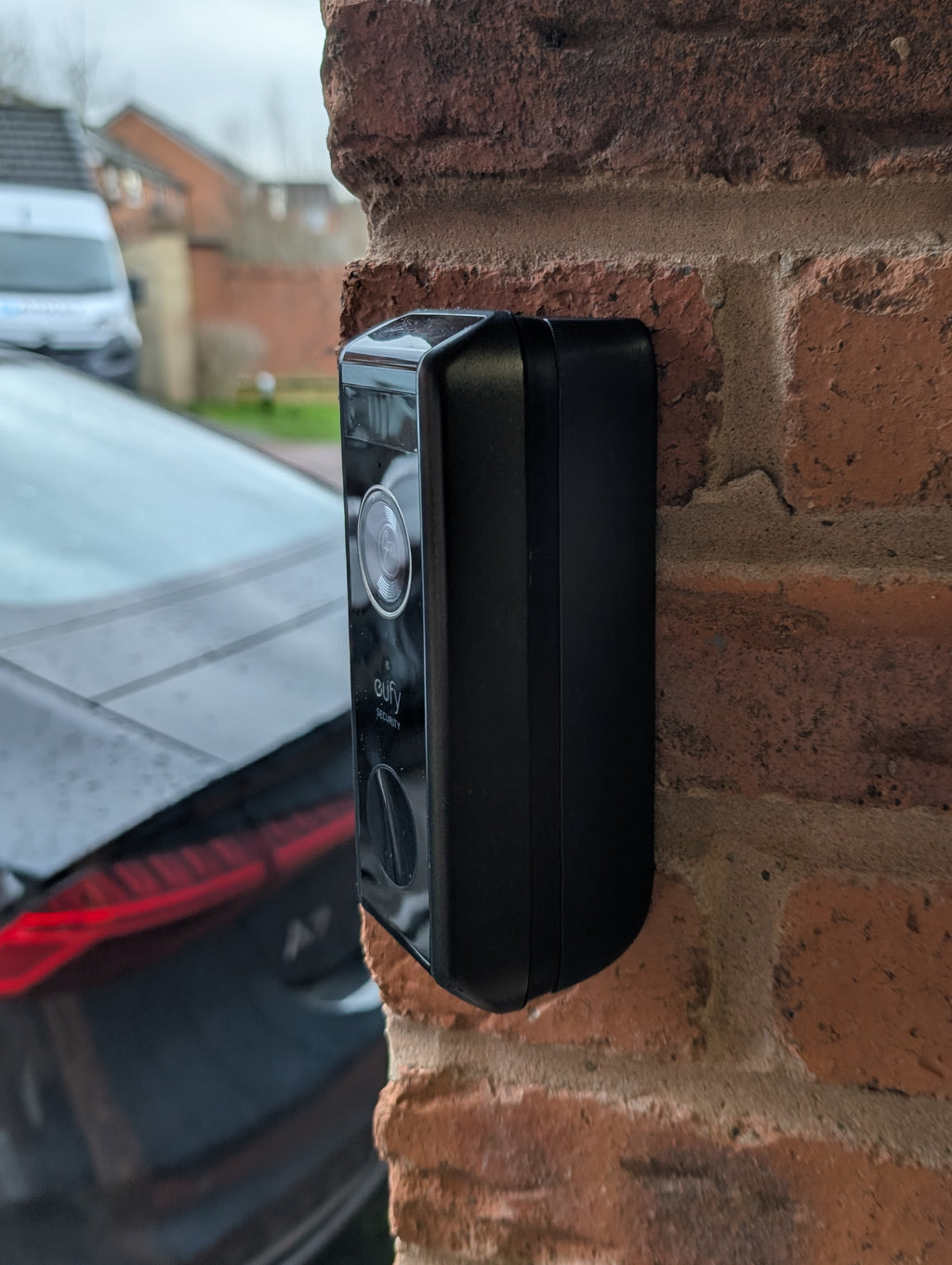 Eufy Video Doorbell Dual S330 Reversible Angle Mount, in black. Mounted on wall.