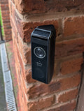 Eufy Video Doorbell Dual S330 Reversible Angle Mount, in black. Mounted on wall.