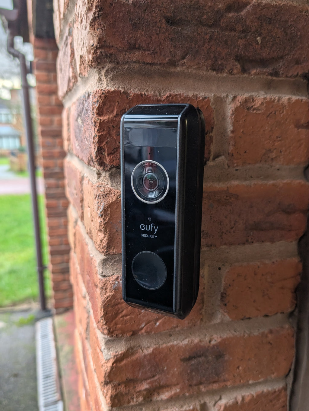 Eufy Video Doorbell Dual S330 Reversible Angle Mount, in black. Mounted on wall.