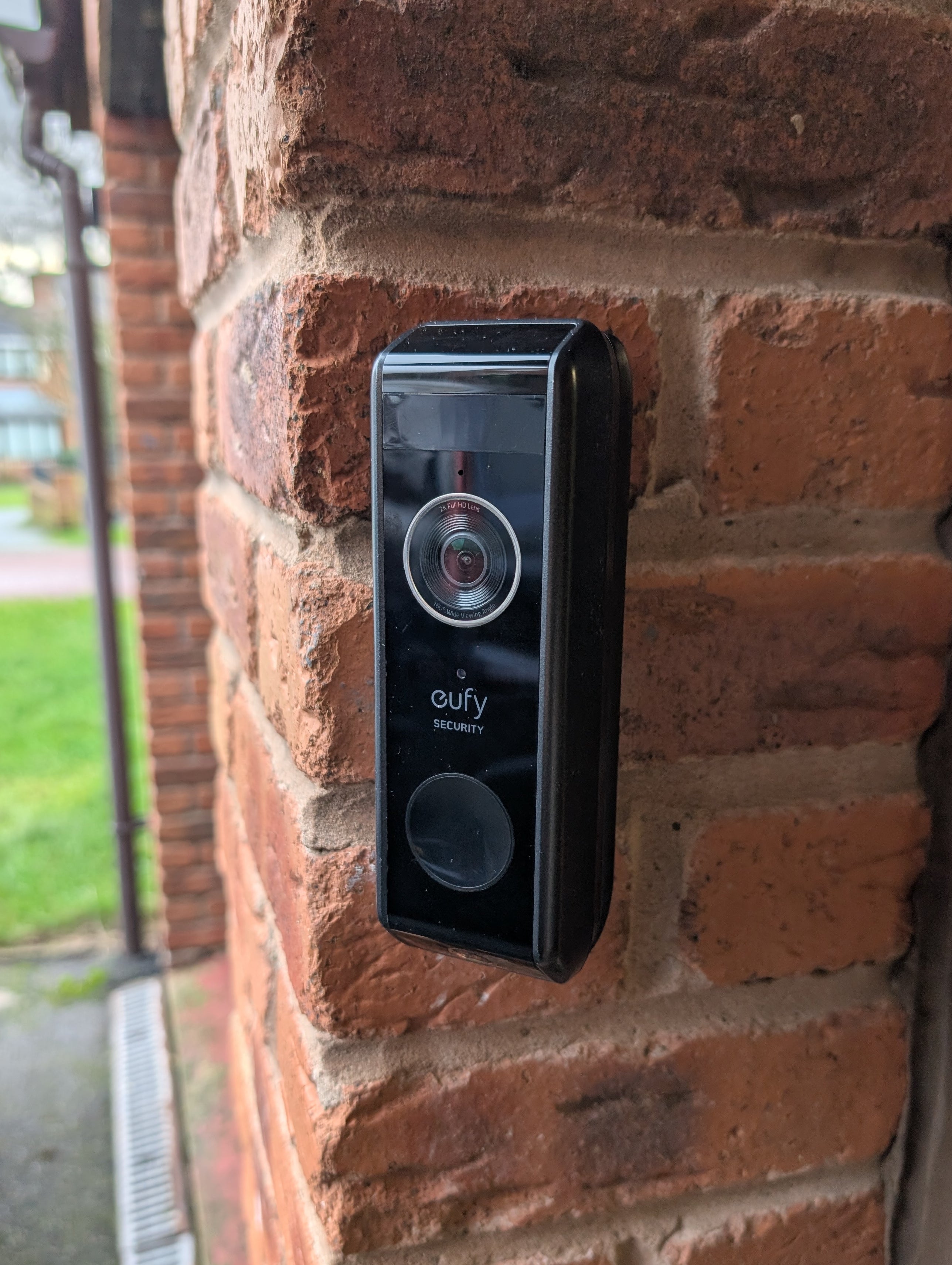 Eufy Video Doorbell Dual S330 Reversible Angle Mount, in black. Mounted on wall.