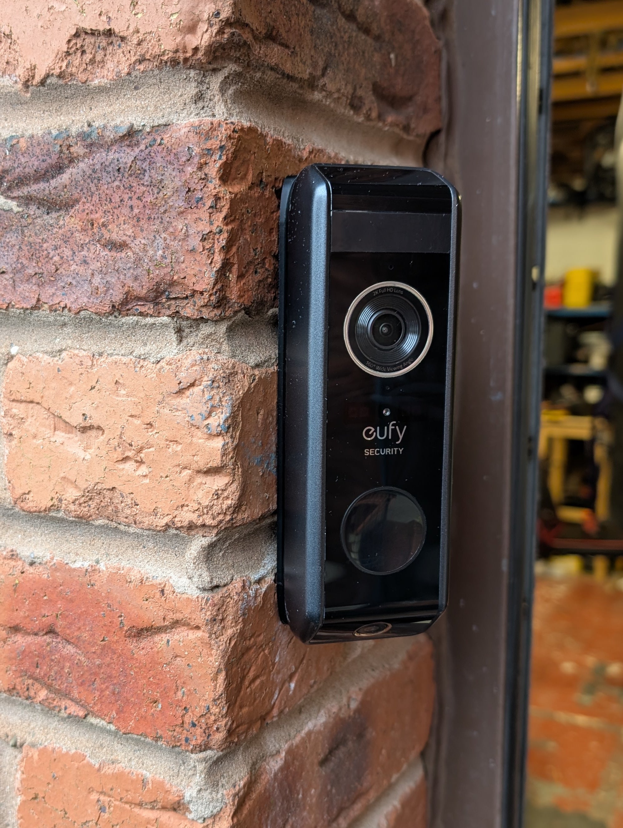 Eufy Video Doorbell Dual S330 Reversible Angle Mount, in black. Mounted on wall.