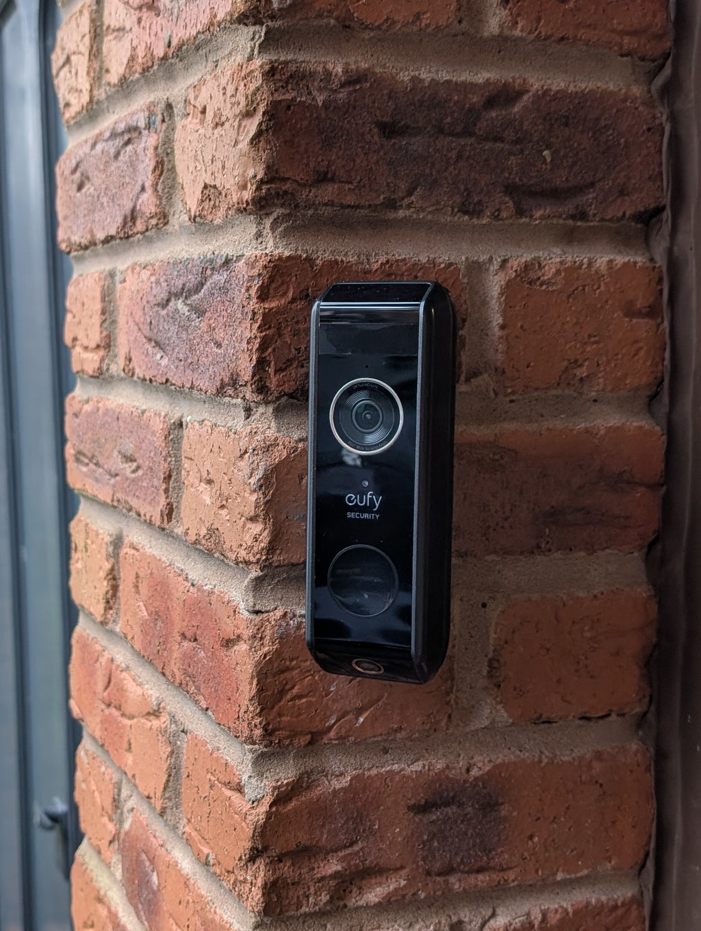 Eufy Video Doorbell Dual S330 Reversible Angle Mount, in black. Mounted on wall.