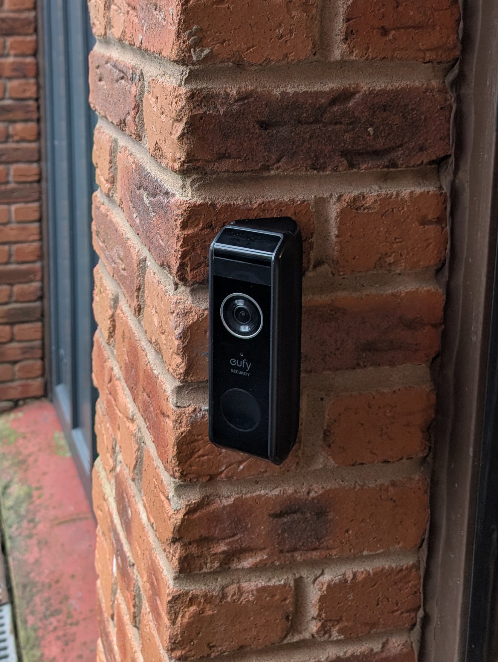 Eufy Video Doorbell Dual S330 Reversible Angle Mount, in black. Mounted on wall.