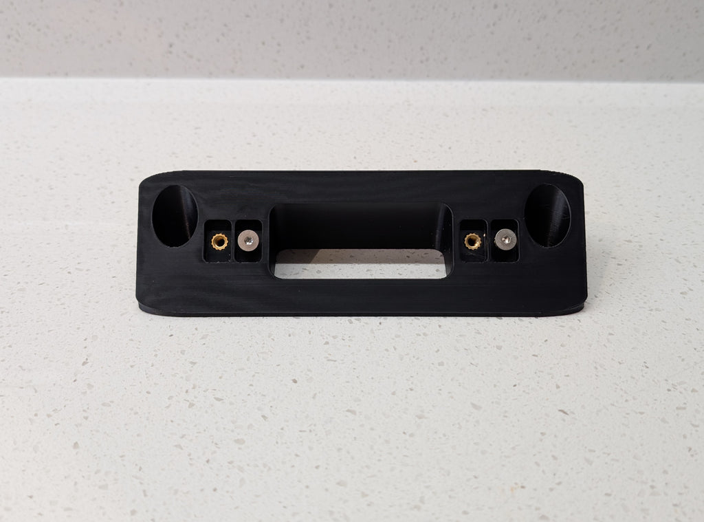 Eufy Video Doorbell Dual S330 Reversible Angle Mount, in black. Unmounted on worksurface.