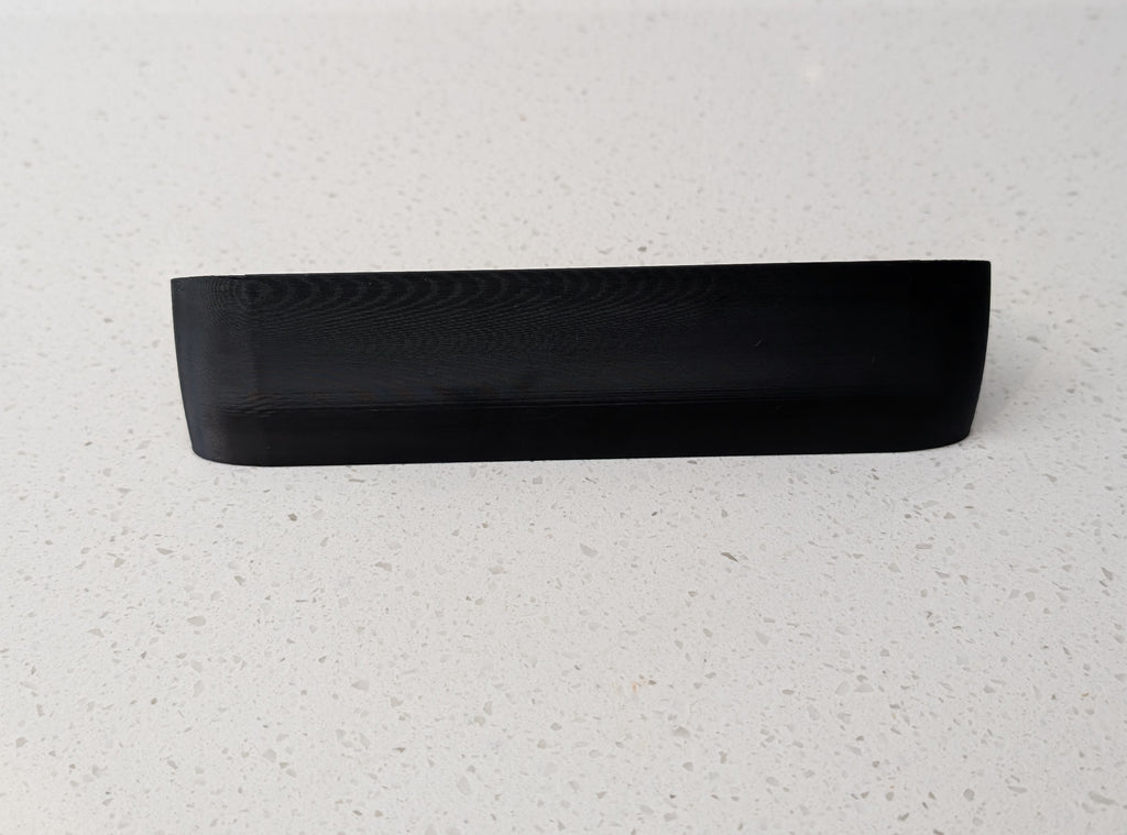 Eufy Video Doorbell Dual S330 Reversible Angle Mount, in black. Unmounted on worksurface.