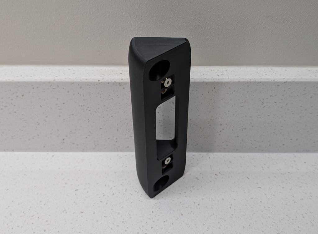 Eufy Video Doorbell Dual S330 Reversible Angle Mount, in black. Unmounted on worksurface.