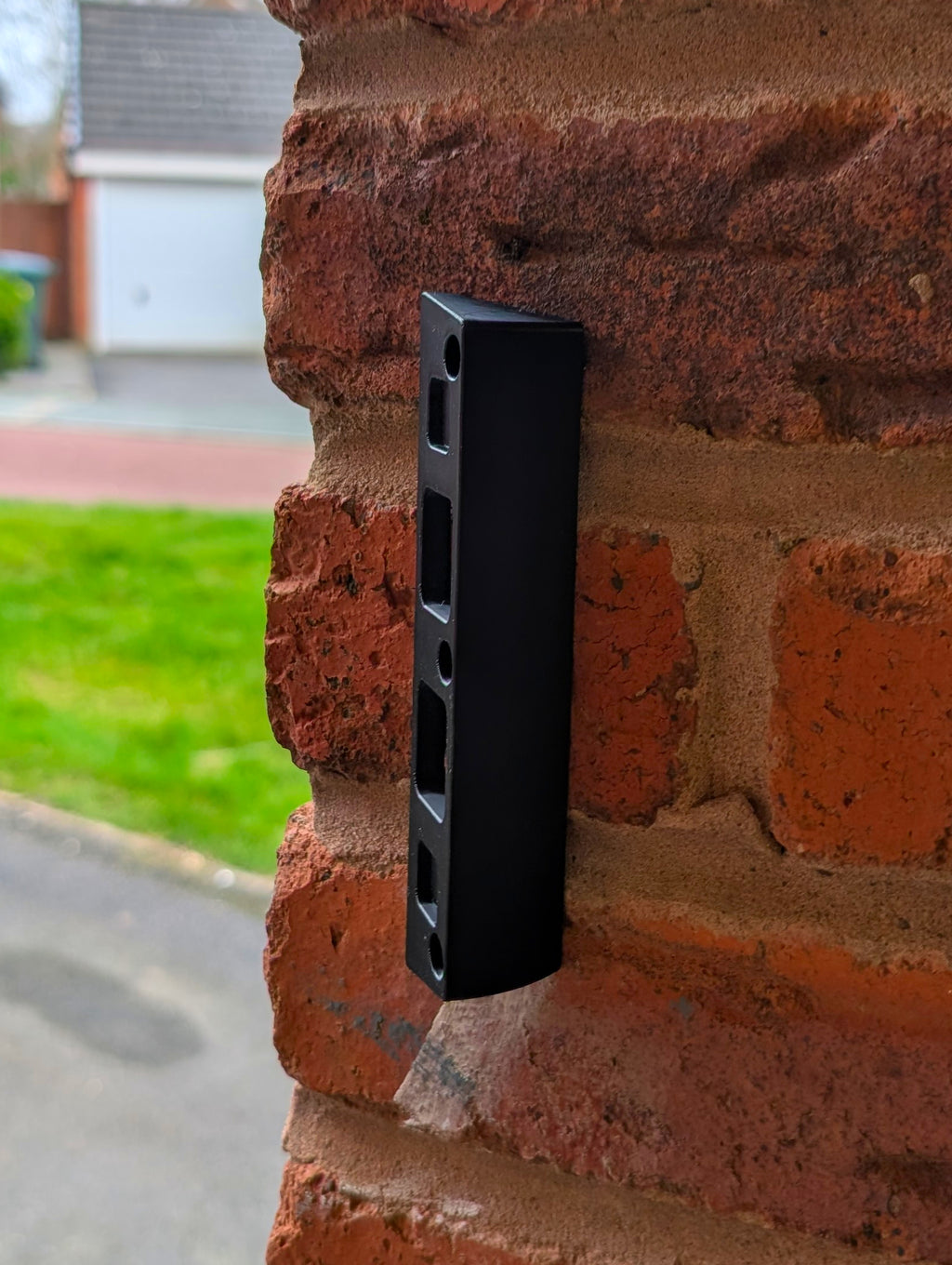 Eufy Video Doorbell E340 Reversible Angle Mount, in black. Mounted on wall.