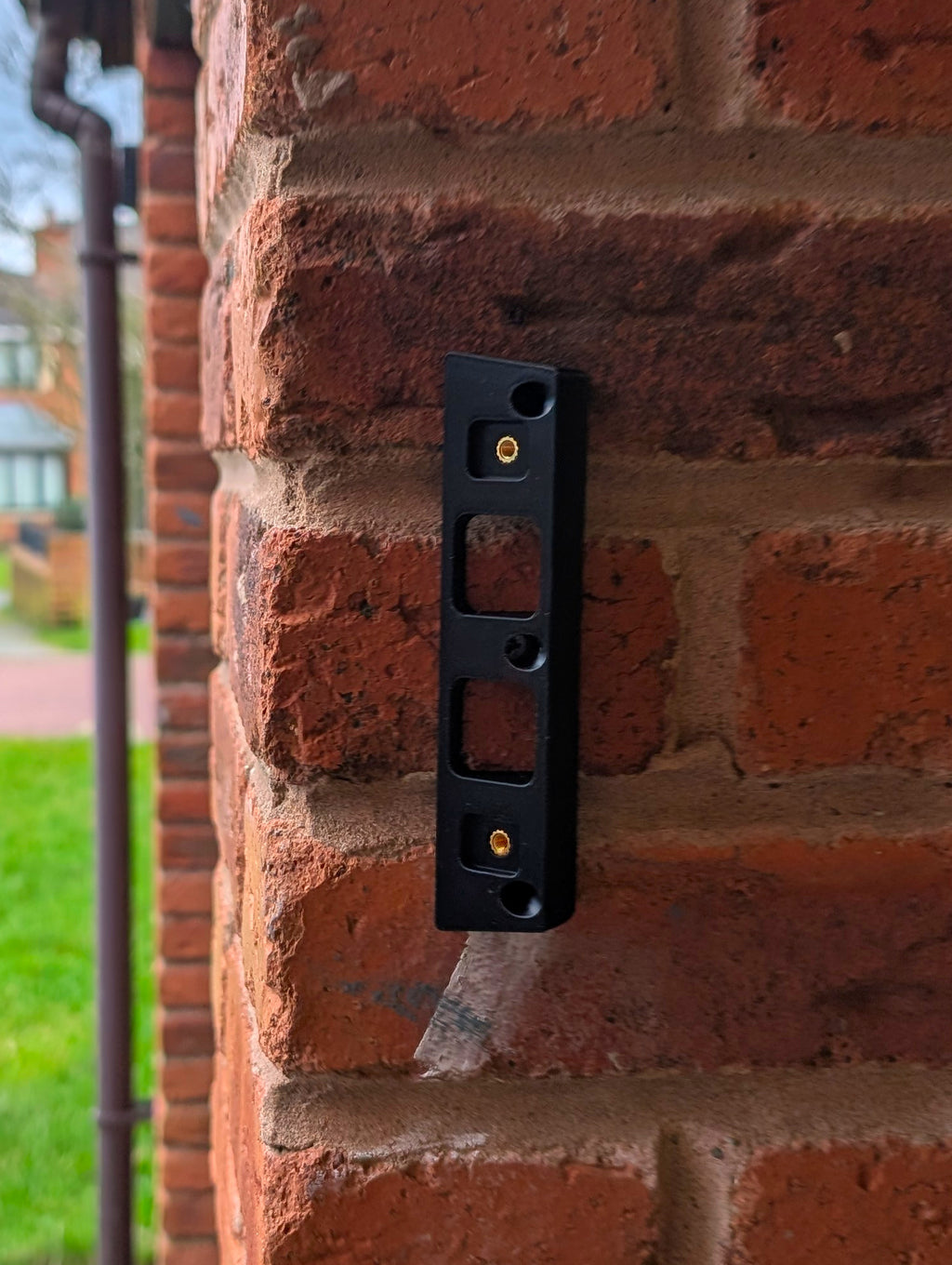 Eufy Video Doorbell E340 Reversible Angle Mount, in black. Mounted on wall.
