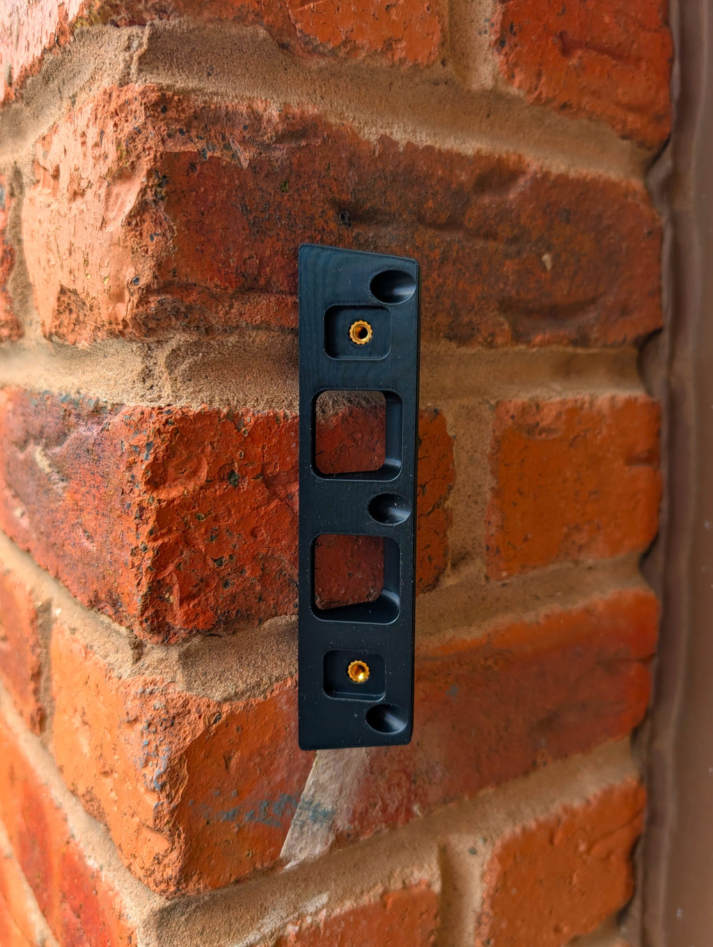 Eufy Video Doorbell E340 Reversible Angle Mount, in black. Mounted on wall.