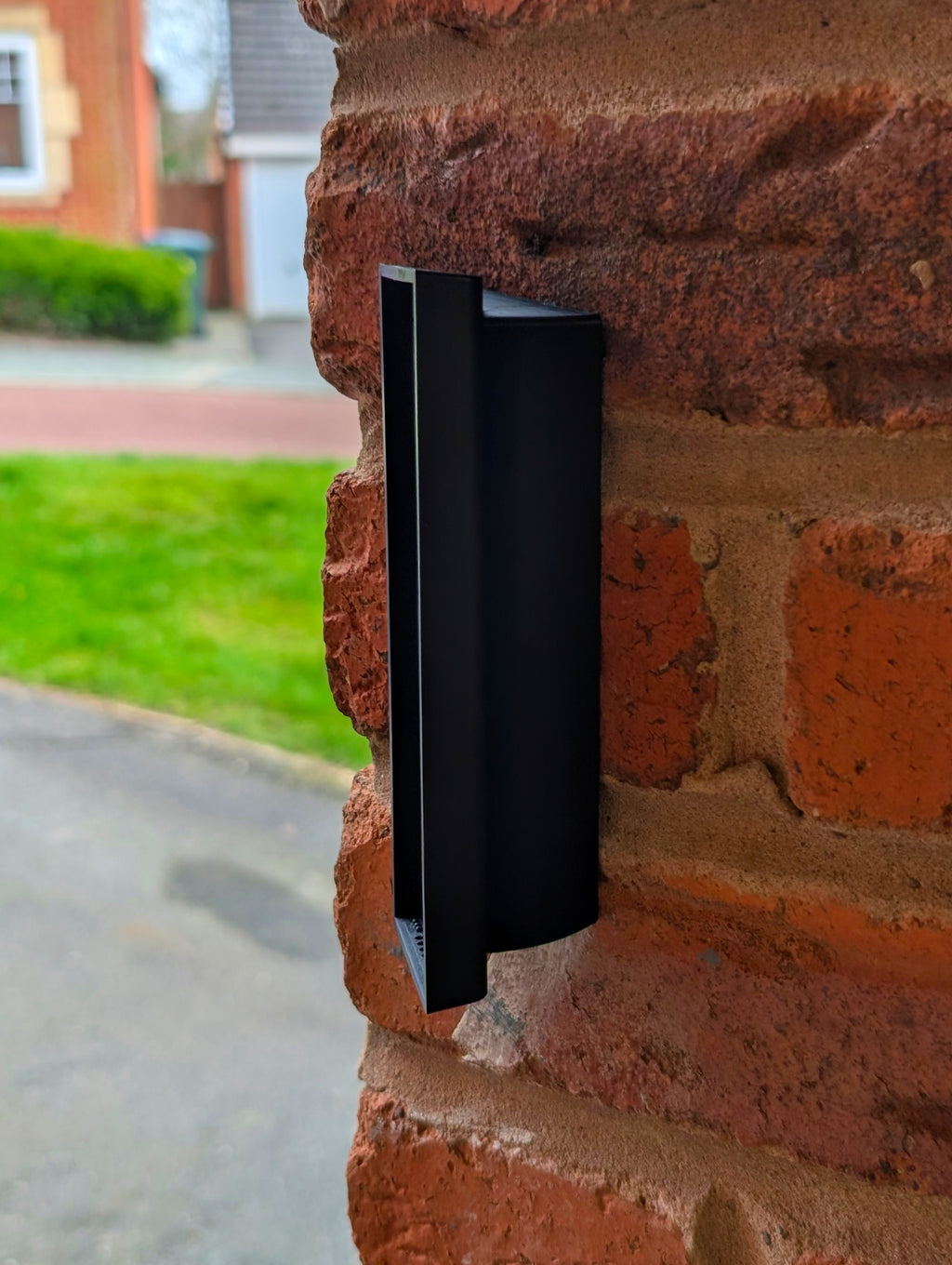 Eufy Video Doorbell E340 Reversible Angle Mount, in black. Mounted on wall.