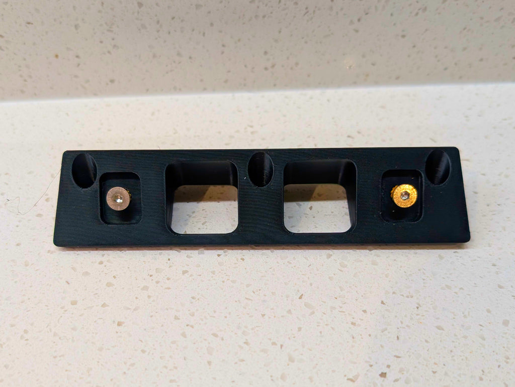 Eufy Video Doorbell E340 Reversible Angle Mount, in black. Unmounted on work surface.