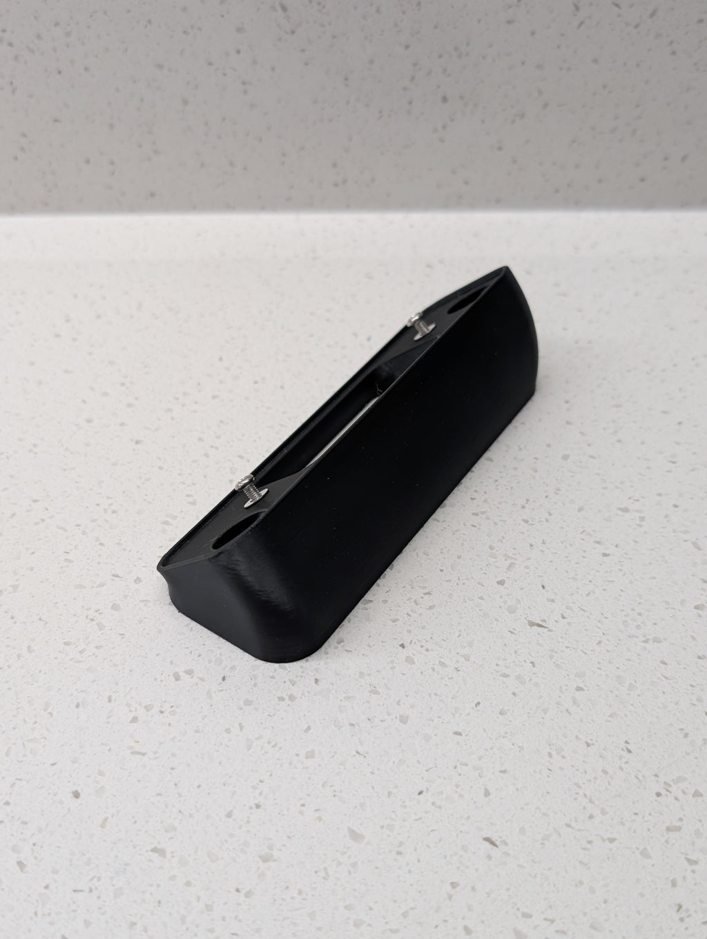 Blink Video Doorbell (2nd Gen) Reversible Angle Mount, in black. Unmounted on work surface.