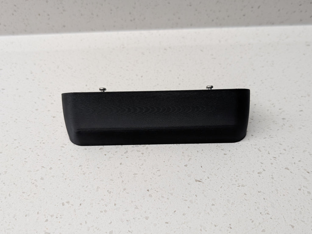 Blink Video Doorbell (2nd Gen) Reversible Angle Mount, in black. Unmounted on work surface.