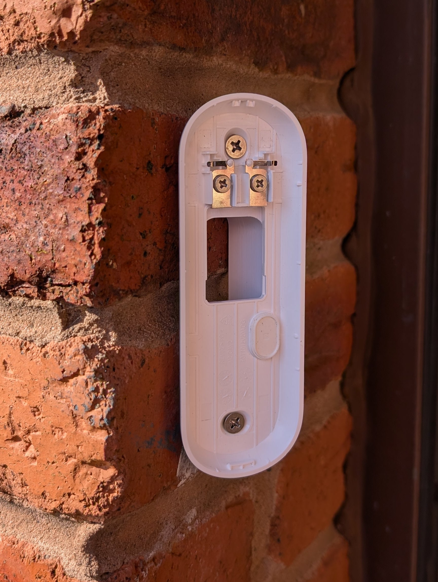 Angled wedge mount for Arlo Gen2 Doorbell, in white.
