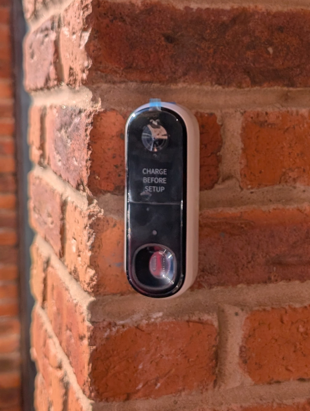Angled wedge mount for Arlo Gen2 Doorbell, in white.