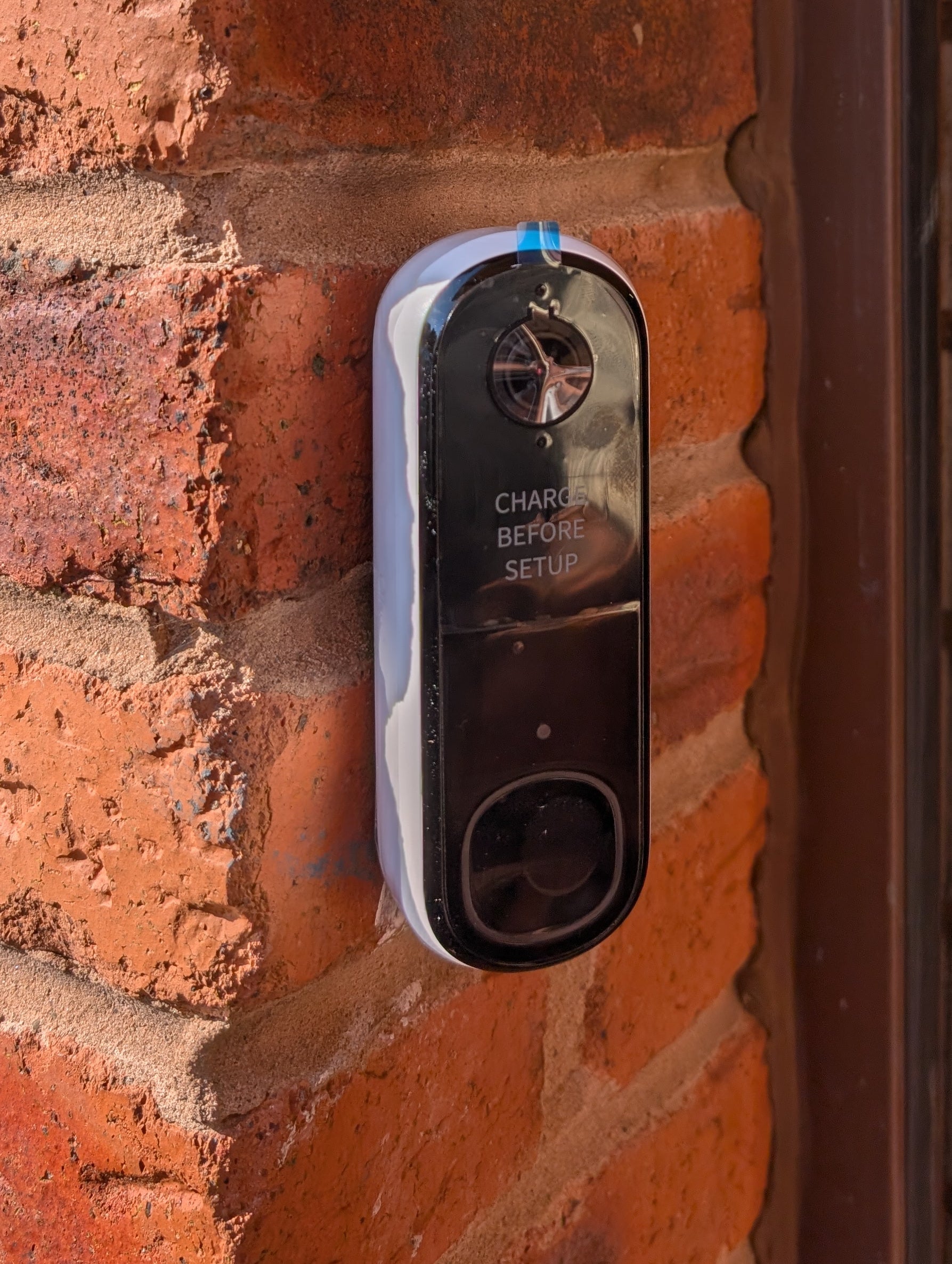 Angled wedge mount for Arlo Gen2 Doorbell, in white.