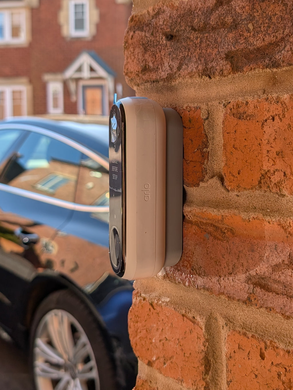 Angled wedge mount for Arlo Gen2 Doorbell, in grey.