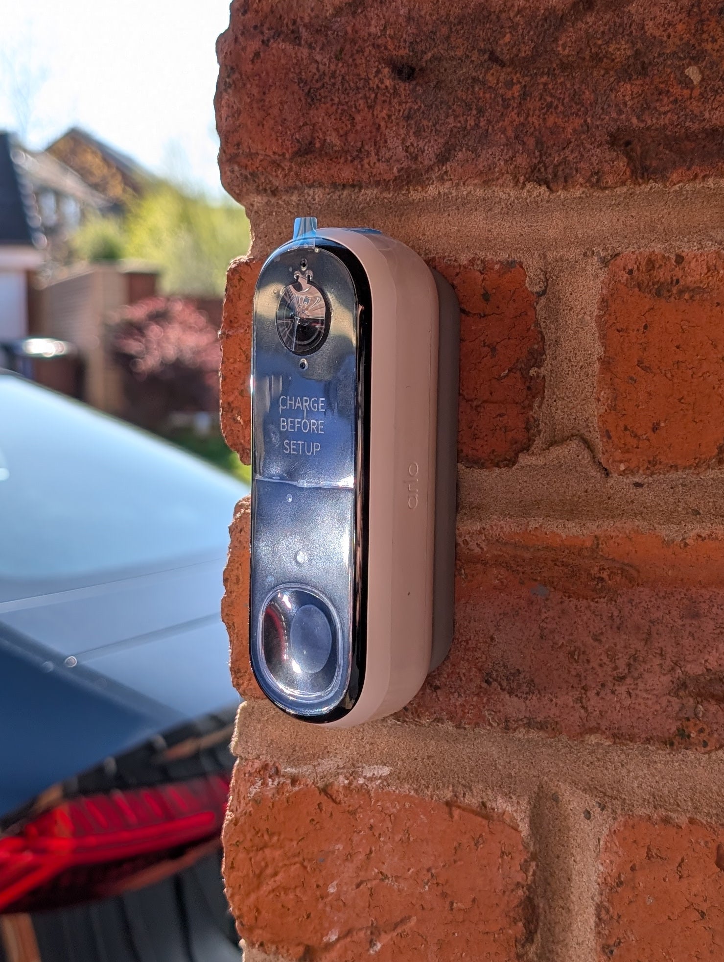 Angled wedge mount for Arlo Gen2 Doorbell, in grey.