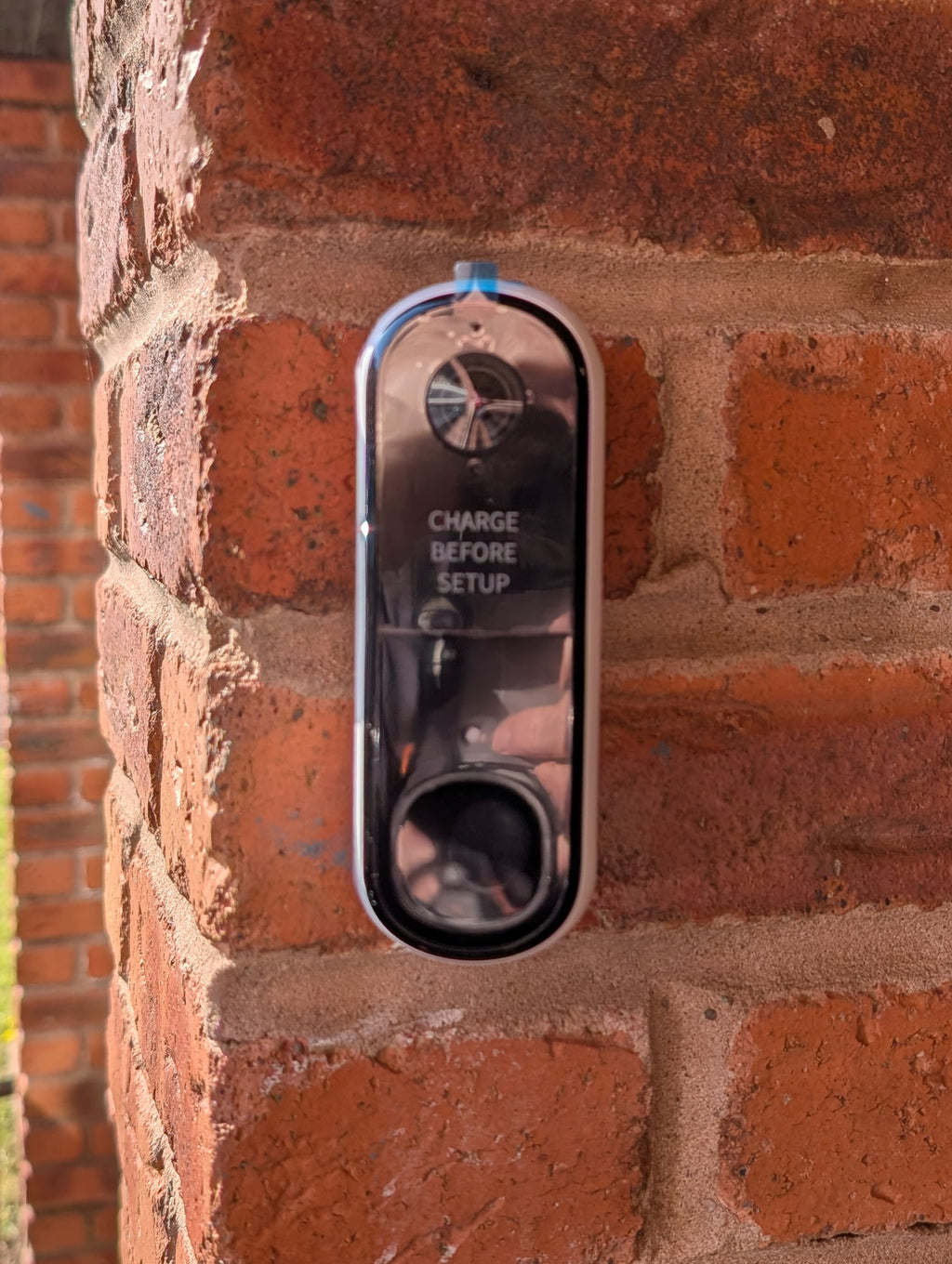 Angled wedge mount for Arlo Gen2 Doorbell, in grey.