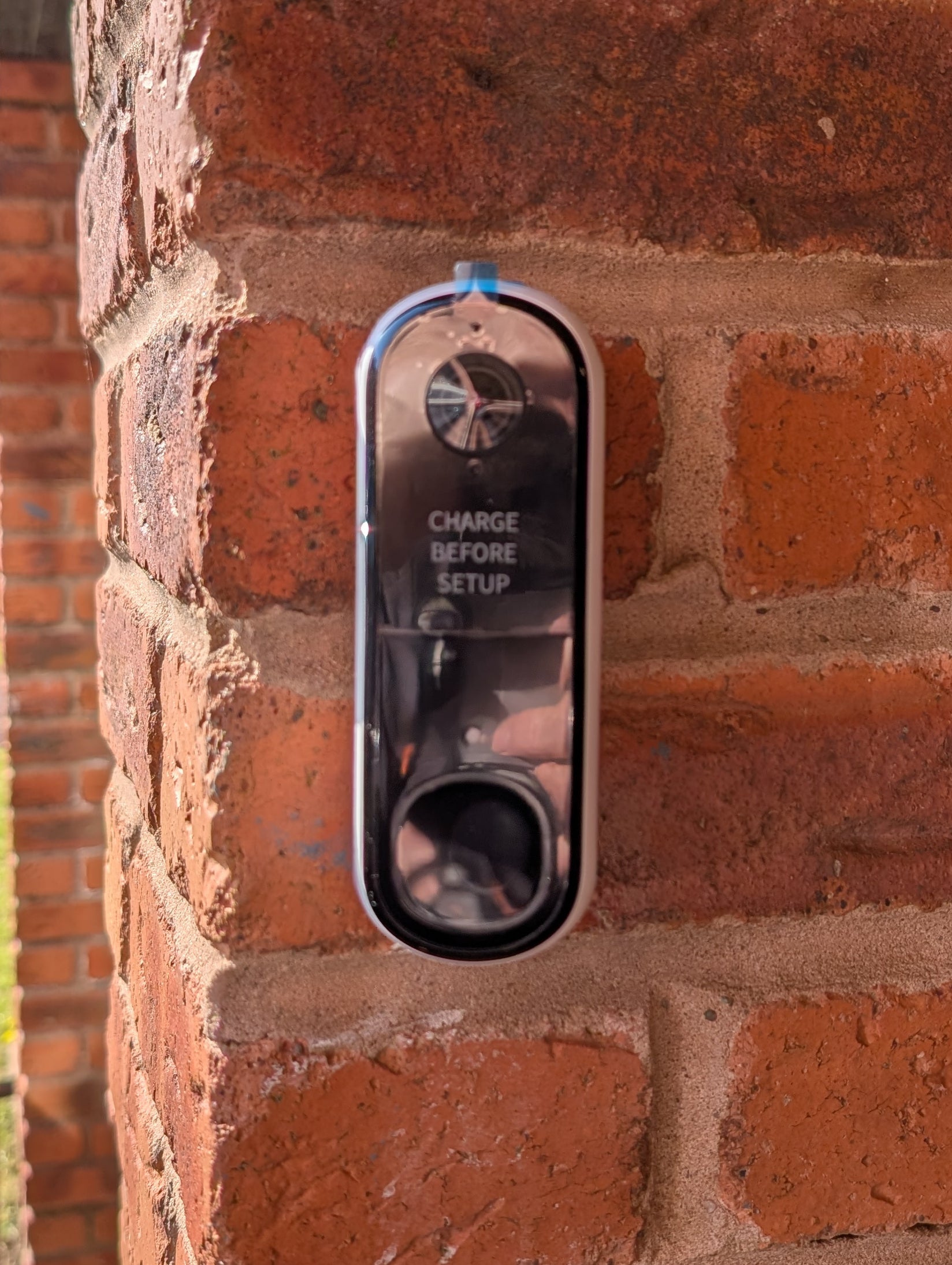 Angled wedge mount for Arlo Gen2 Doorbell, in grey.