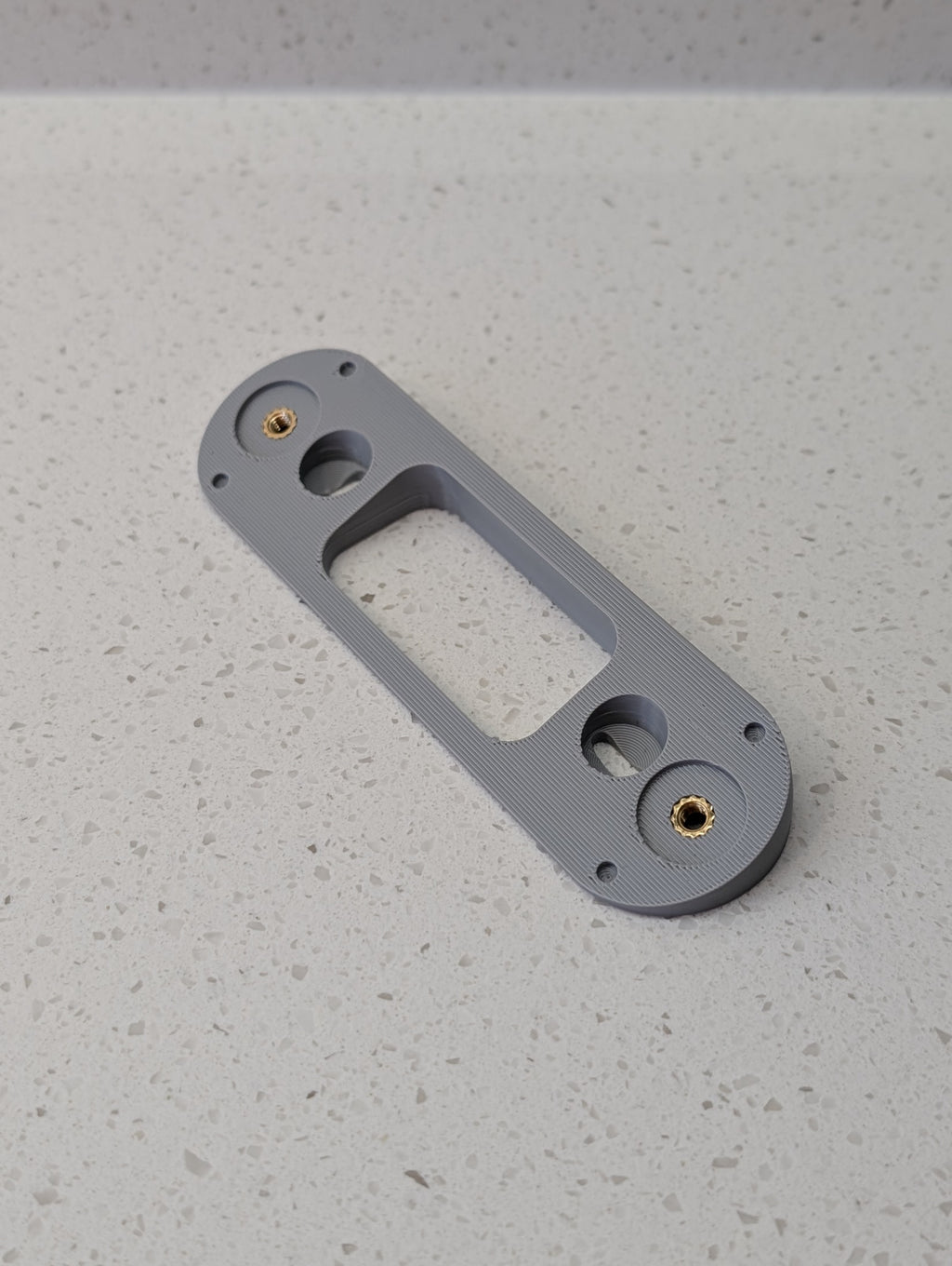 Angled wedge mount for Arlo Gen2 Doorbell, in grey.