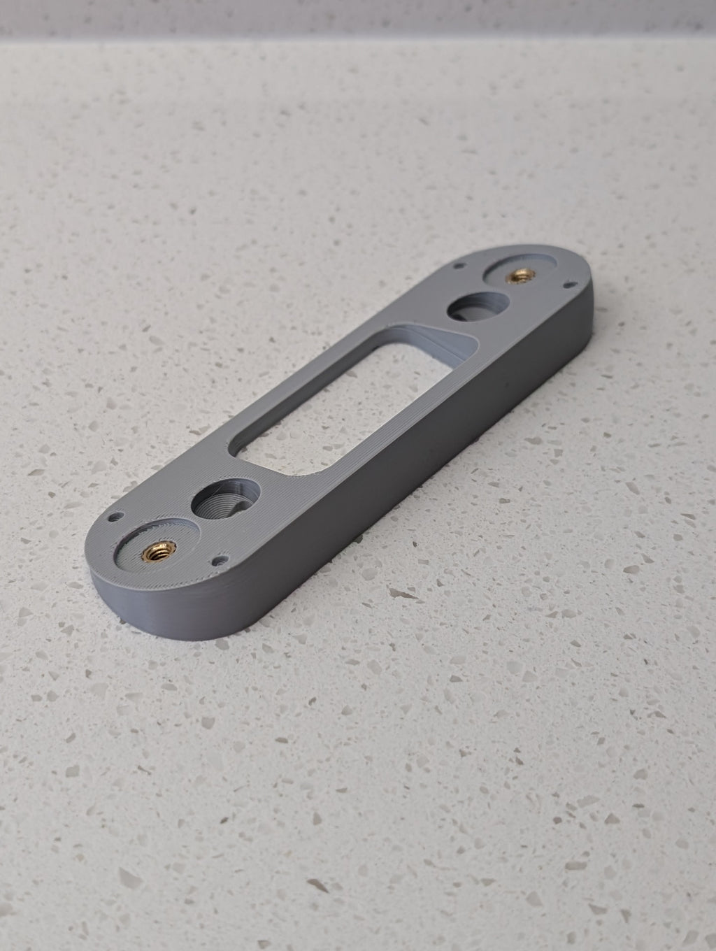 Angled wedge mount for Arlo Gen2 Doorbell, in grey.