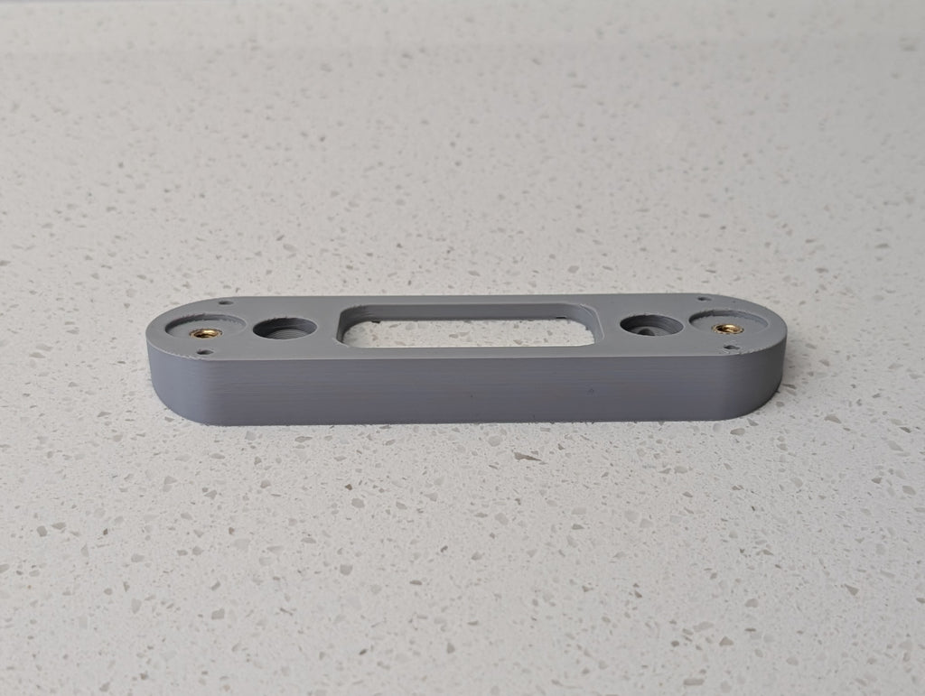 Angled wedge mount for Arlo Gen2 Doorbell, in grey.