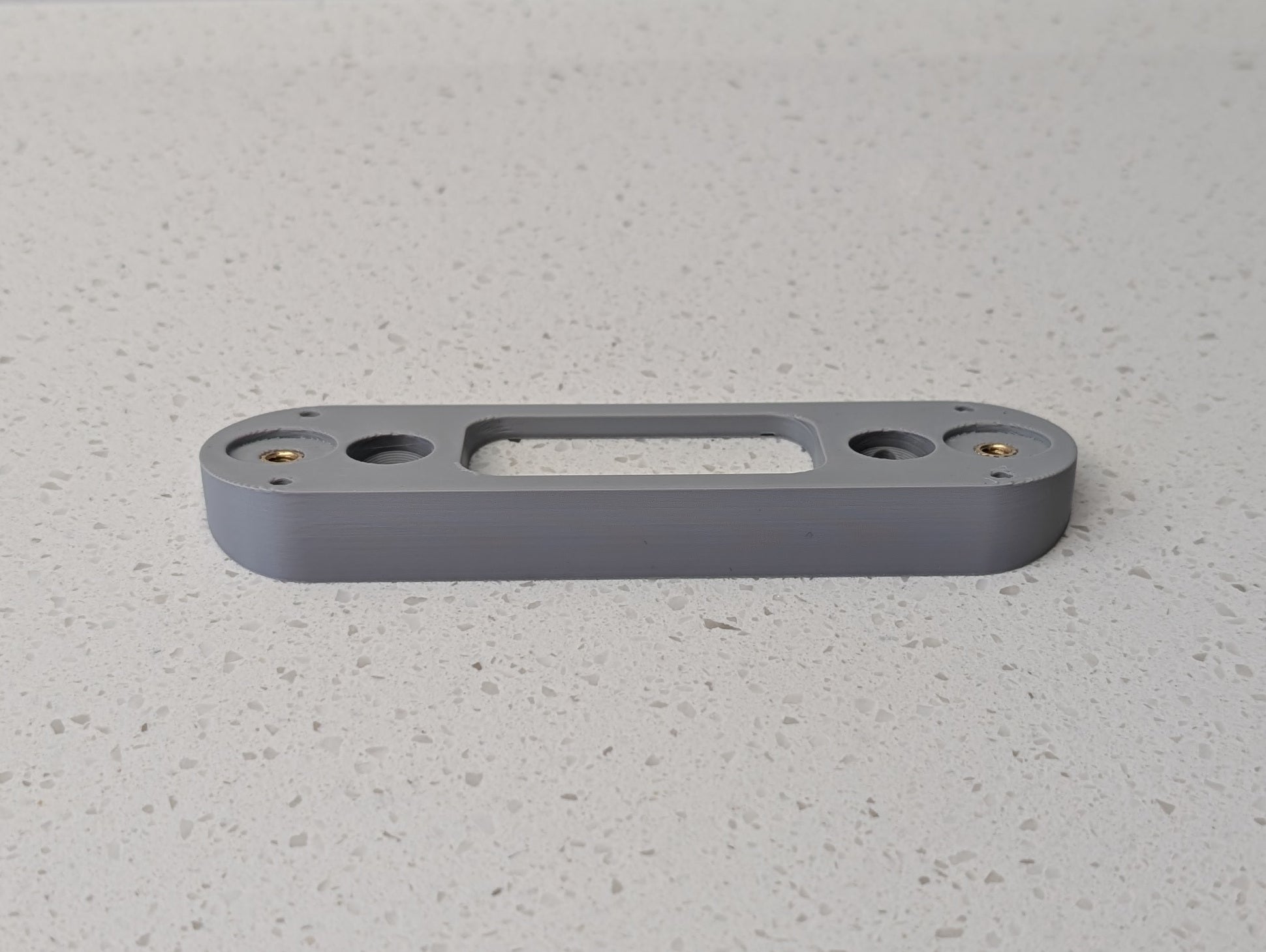 Angled wedge mount for Arlo Gen2 Doorbell, in grey.