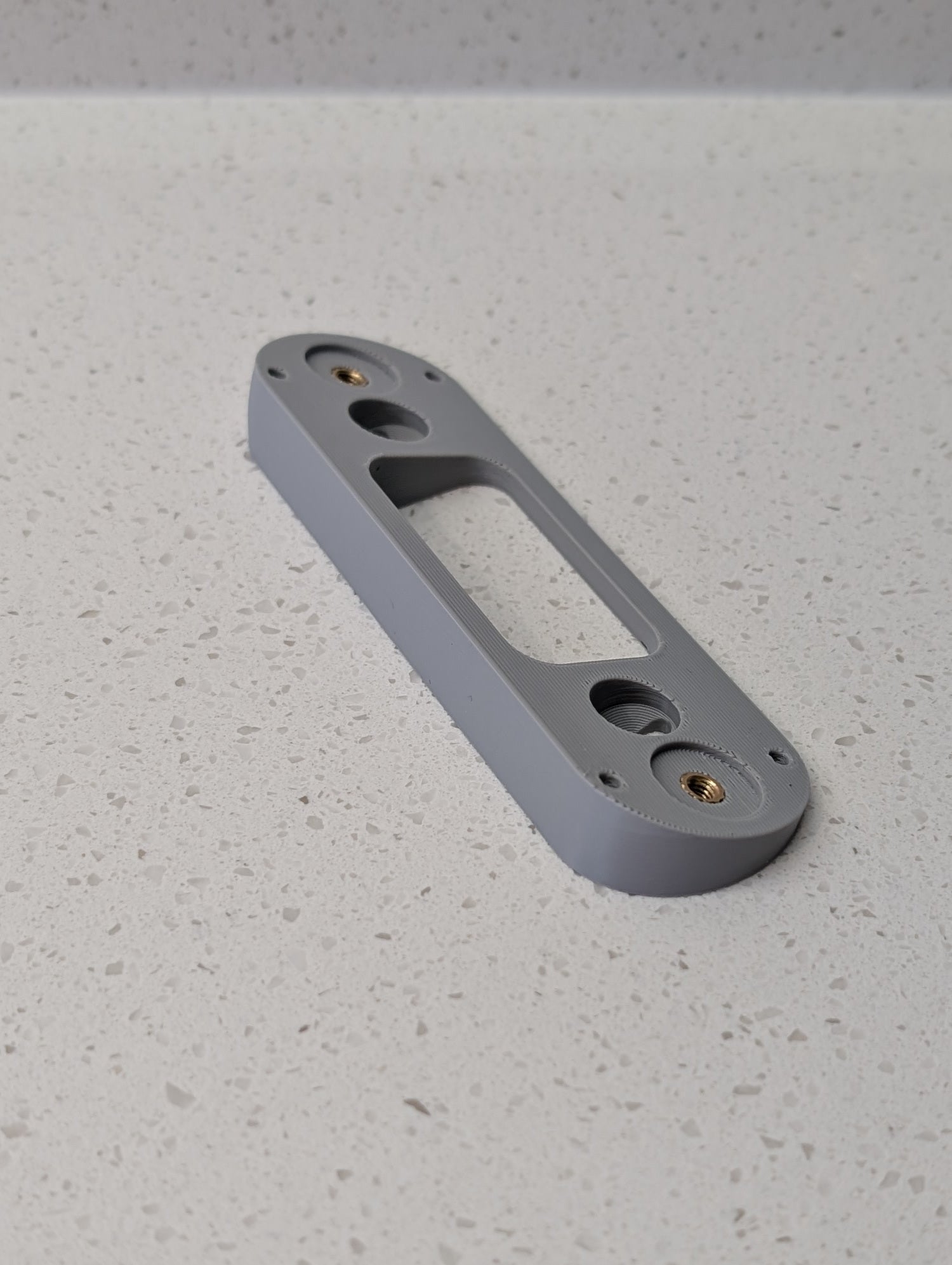 Angled wedge mount for Arlo Gen2 Doorbell, in grey.