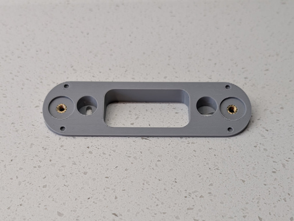 Angled wedge mount for Arlo Gen2 Doorbell, in grey.