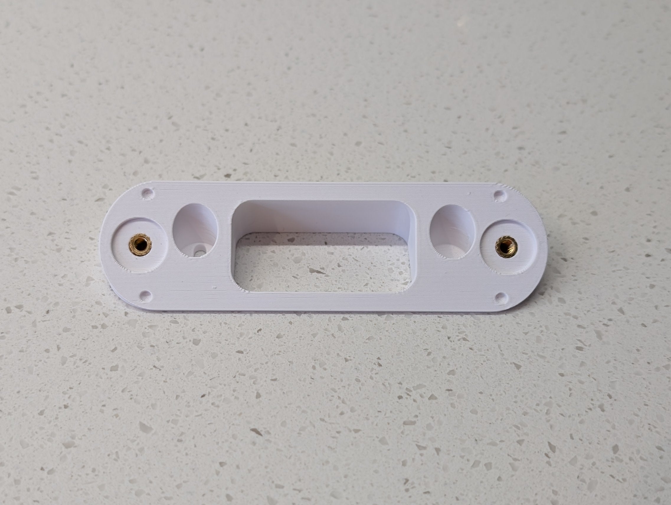 Angled wedge mount for Arlo Gen2 Doorbell, in white.