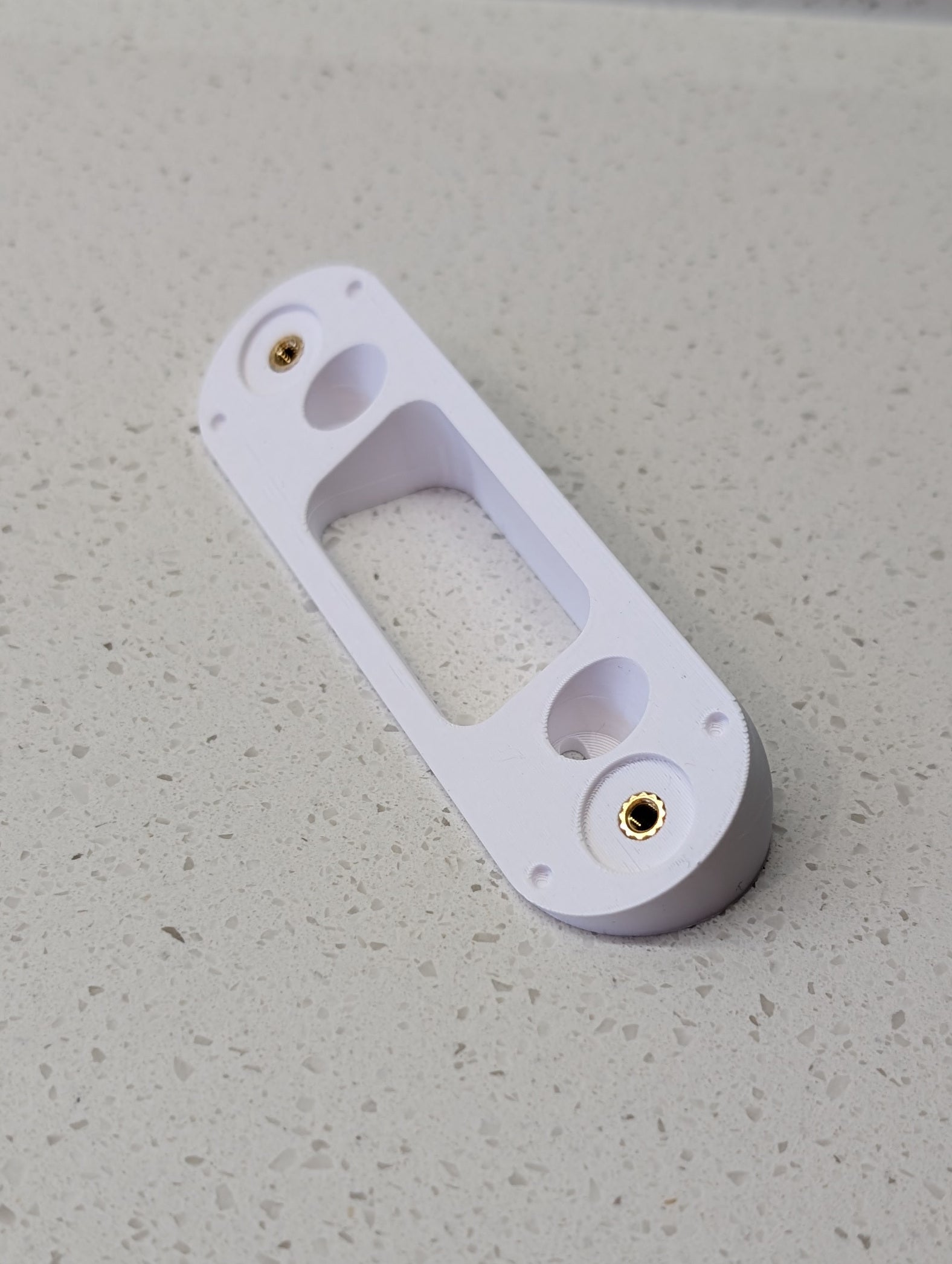 Angled wedge mount for Arlo Gen2 Doorbell, in white.