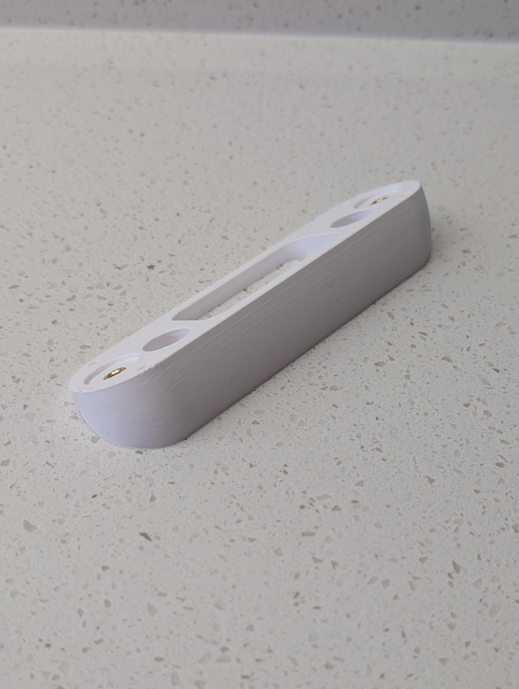 Angled wedge mount for Arlo Gen2 Doorbell, in white.