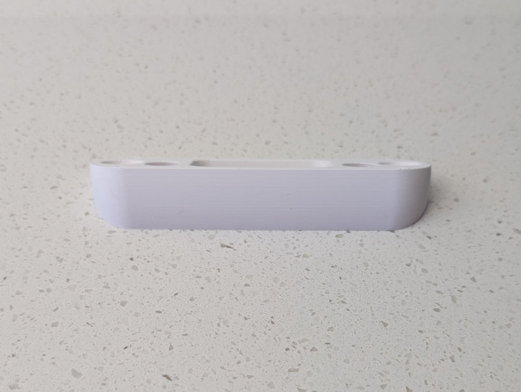 Angled wedge mount for Arlo Gen2 Doorbell, in white.