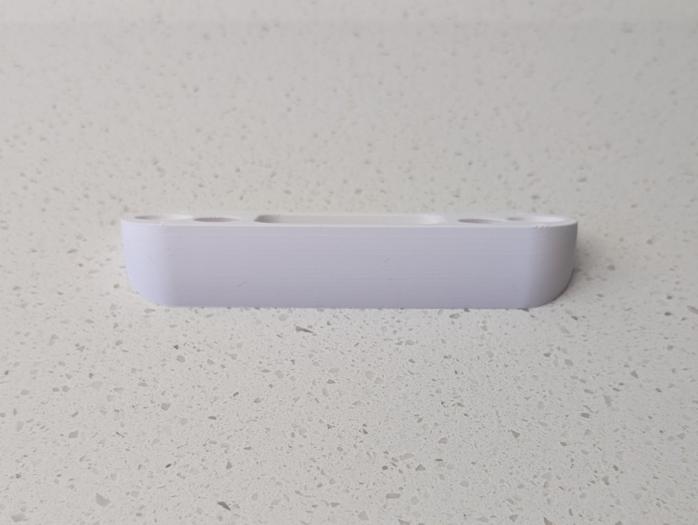 Angled wedge mount for Arlo Gen2 Doorbell, in white.