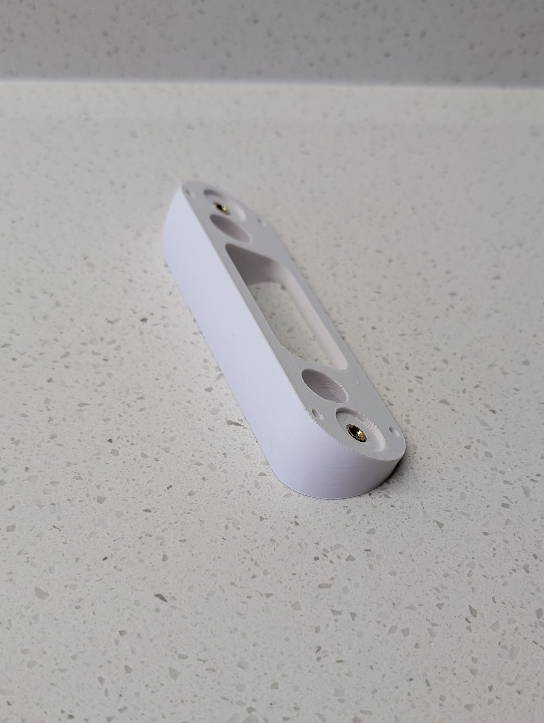 Angled wedge mount for Arlo Gen2 Doorbell, in white.