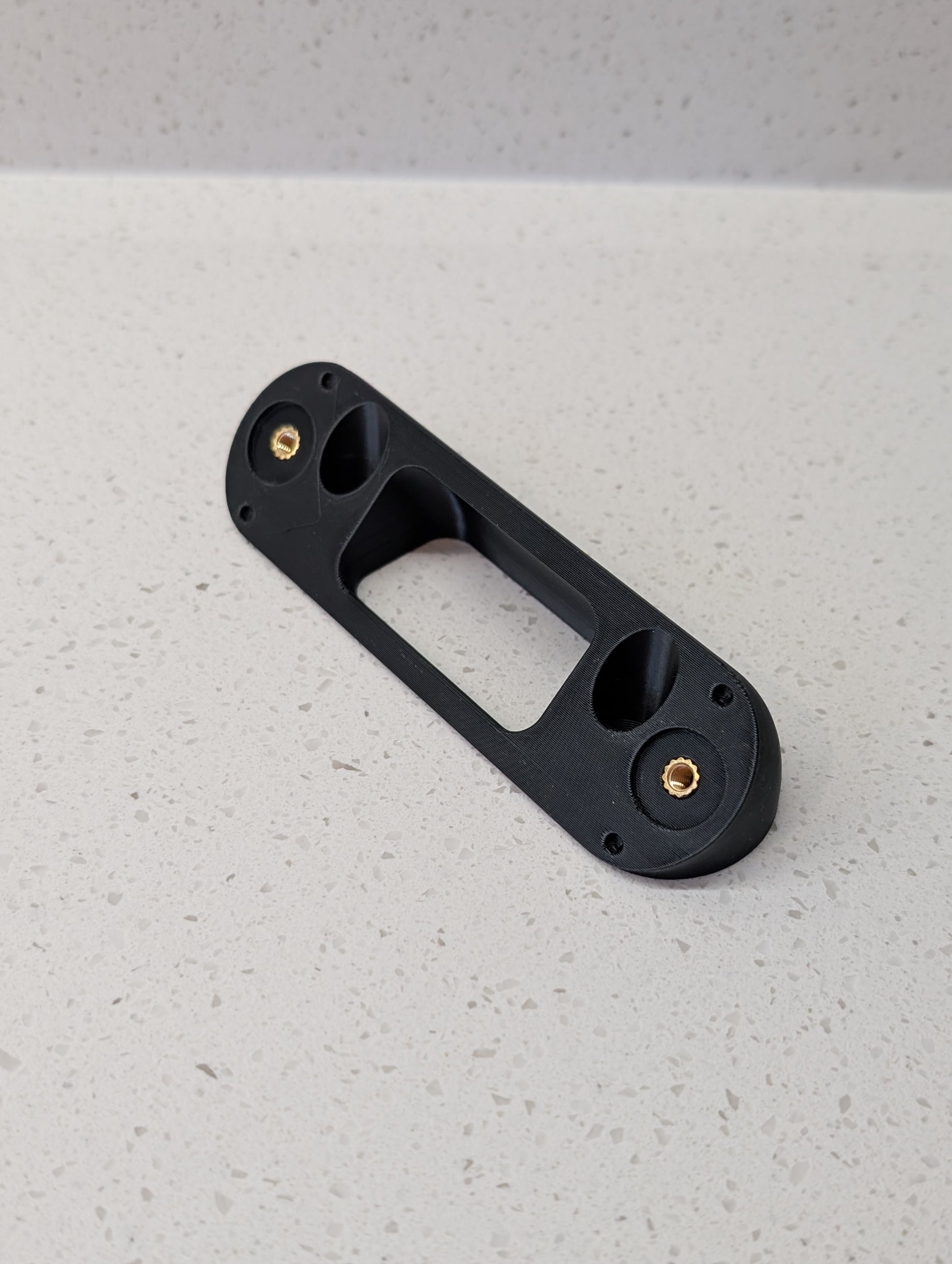 Angled wedge mount for Arlo Gen2 Doorbell, in black.