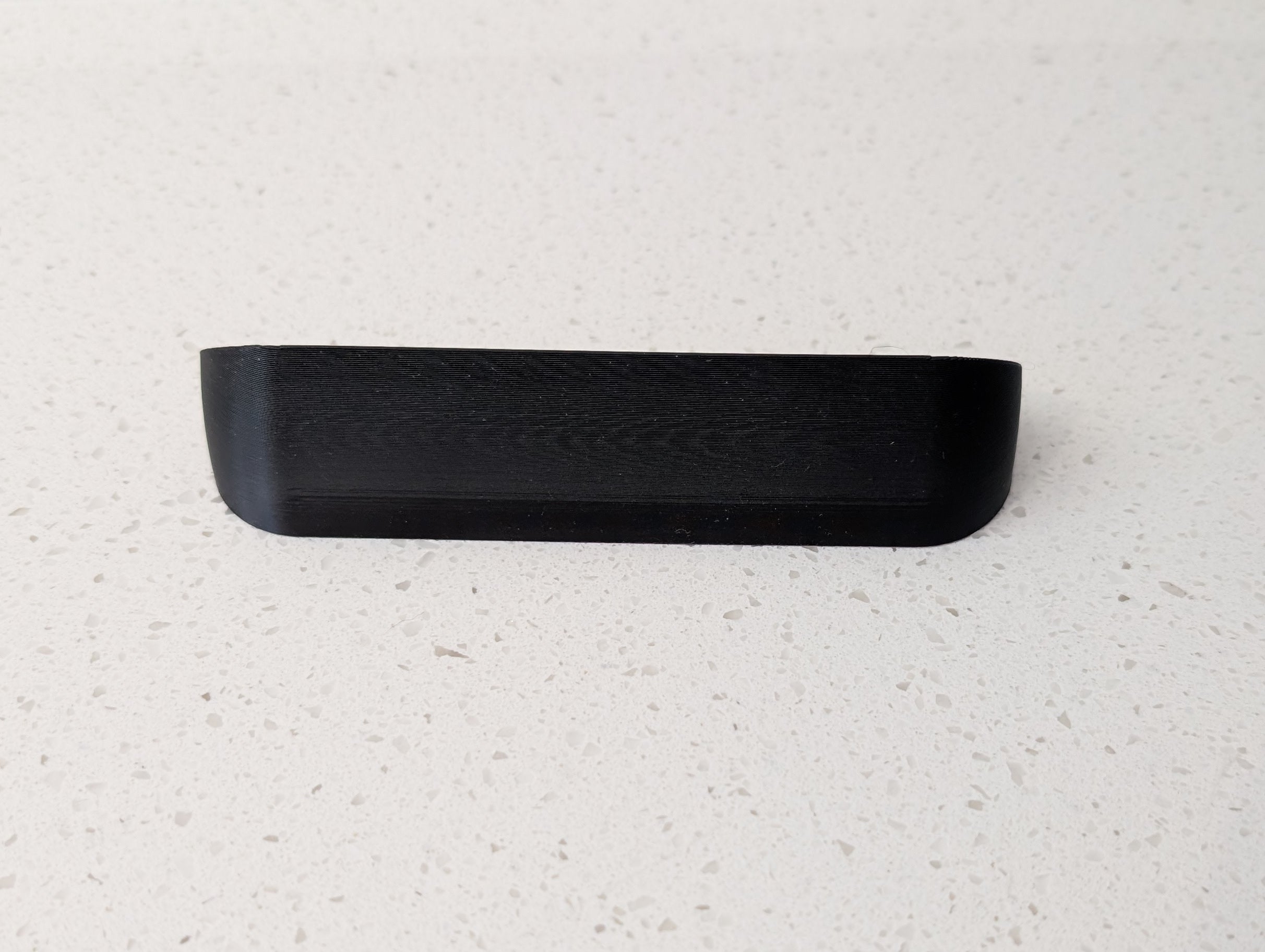 Angled wedge mount for Arlo Gen2 Doorbell, in black.