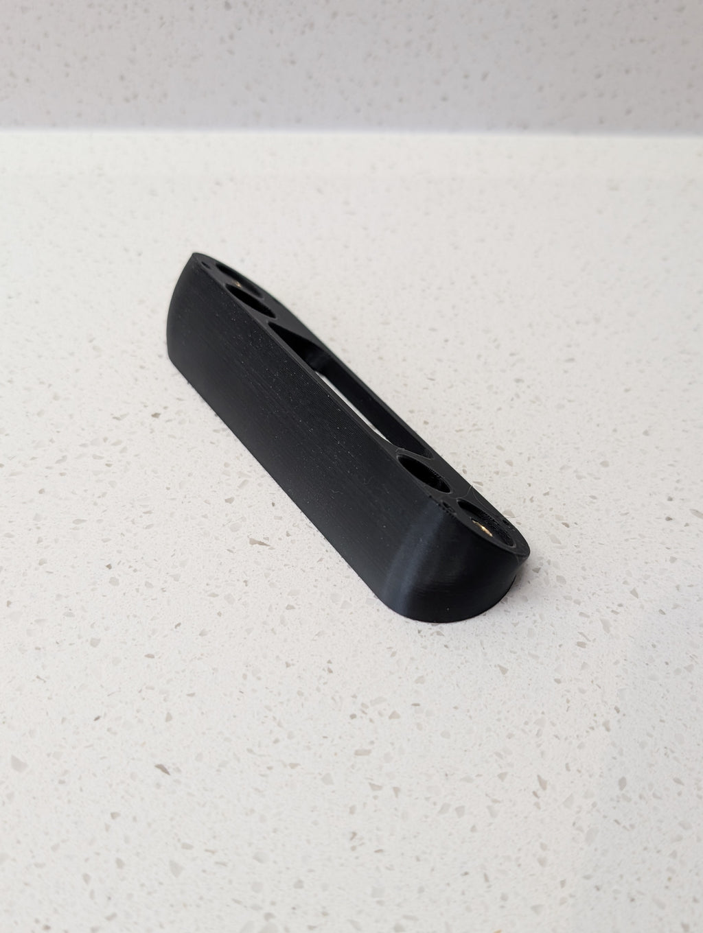 Angled wedge mount for Arlo Gen2 Doorbell, in black.